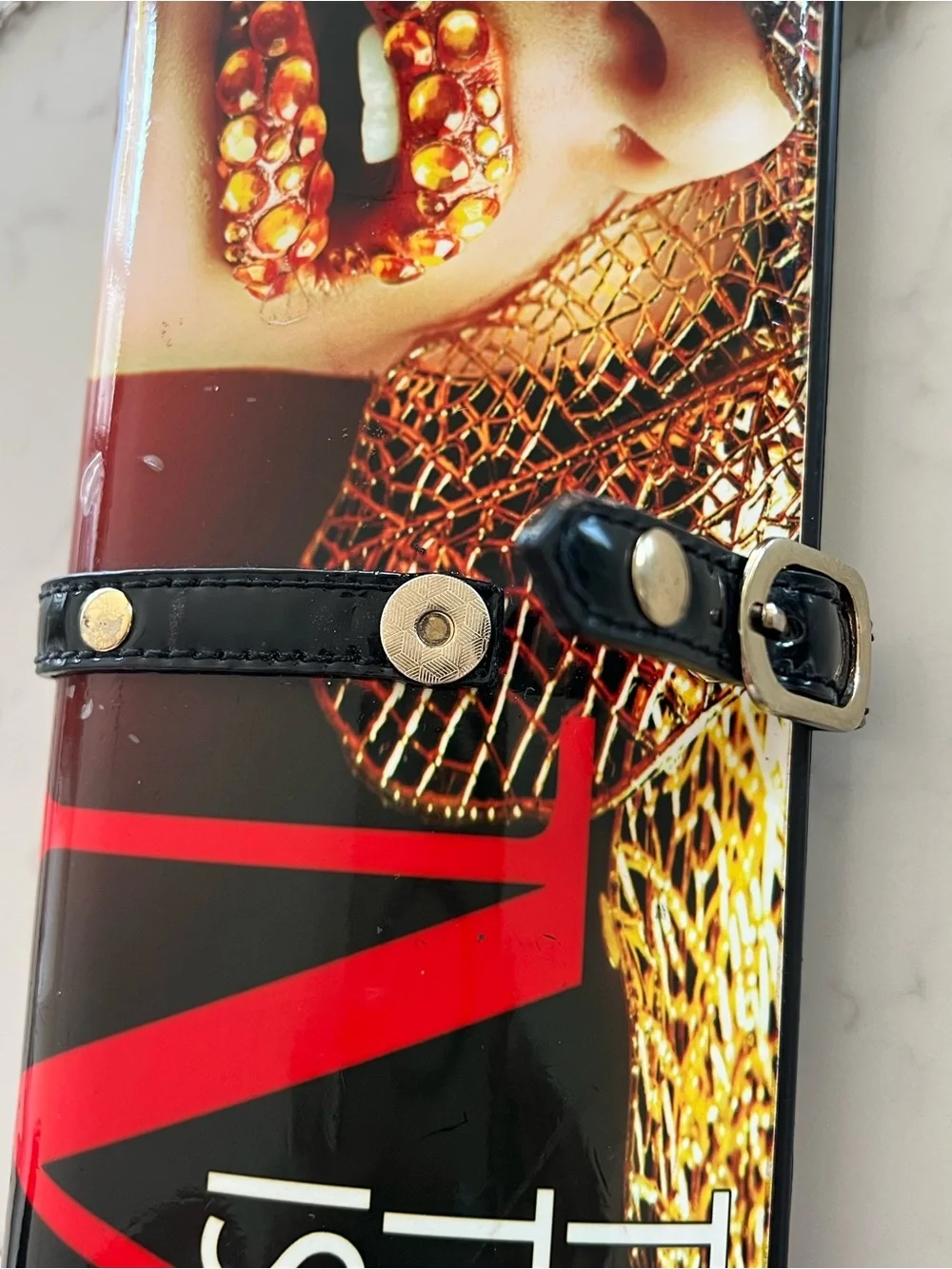 Edgy 80s rolled magazine clutch hard case with crossbody chain red and black